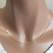 Sideways cross necklace in gold